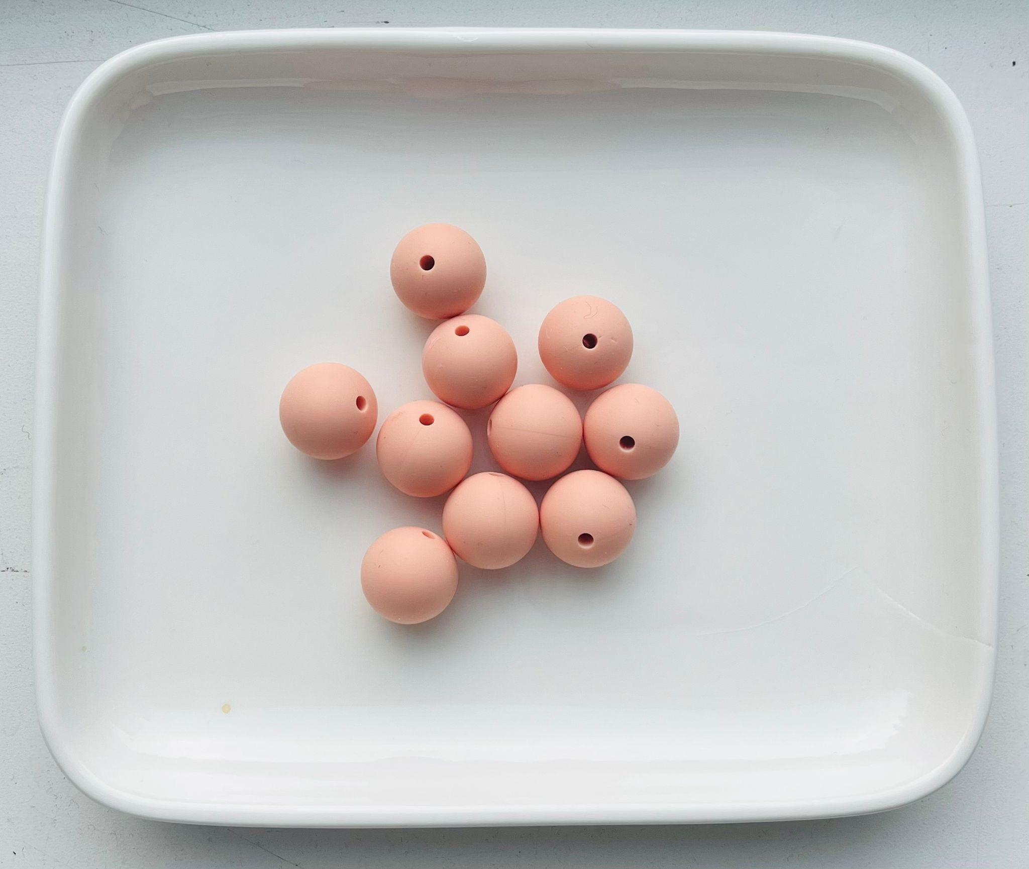 Oransje silikonperler