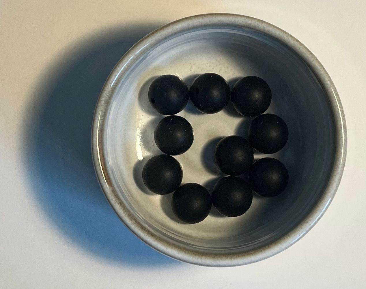 Svart silikonperler
